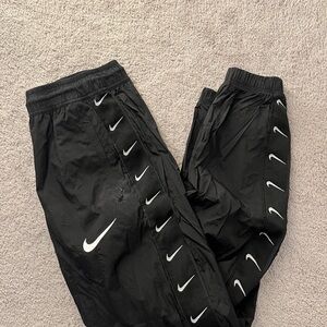 Nike Windbreaker Joggers with White Swoosh Accents